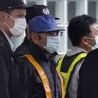 Maintaining his innocence: Former Nissan Chairman Carlos Ghosn leaves the Tokyo Detention House on Tuesday following his release on bail. | BLOOMBERG