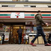 In the line of fire: Seven-Eleven Japan Co. franchises are required to keep their stores open 24/7. | BLOOMBERG