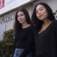 New voices:  Students Hikari Hida (right) and Trica Euvrard started Uprizine, a zine focusing on social issues in Japan, after another student at their university was sexually assaulted. | STEVE WHITE II