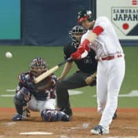 Mexico\'s Joey Meneses doubles during the fourth inning of his team\'s victory over Japan on Saturday night at Kyocera Dome in Osaka. Mexico won 4-2. | KYODO