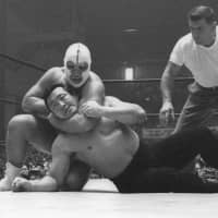 Former pro wrestler Richard \"The Destroyer\" Beyer (top), seen in a May 1963 file photo, died on Thursday. He was 88. | KYODO