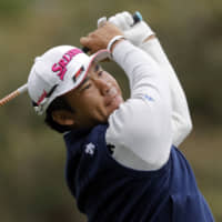 Hideki Matsuyama hits his tee shot on the second hole during the final round of The Players Championship golf tournament Sunday in Ponte Vedra Beach, Florida. | AP