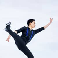 Tomoki Hiwatashi performs his short program at the world junior championships on Wednesday in Zagreb. | ISU