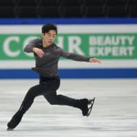 Nathan Chen prepares for the World Figure Skating Championships during a practice session at Saitama Super Arena on Tuesday. Chen is seeking to become the first American to return to the top of the podium since Scott Hamilton defended his title in 1984. | DAN ORLOWITZ
