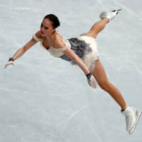 Russia\'s Alina Zagitova performs her short program at the World Figure Skating Championships on Wednesday at Saitama Super Arena. Zagitova leads the field with 82.08 points. | REUTERS