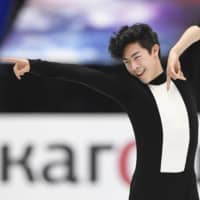 Reigning world champion Nathan Chen delivers a fine display of artistry and athleticism in the men\'s short program at the World Figure Skating Championships on Thursday night at Saitama Super Arena. Chen leads the field with 107.40 points. | KYODO