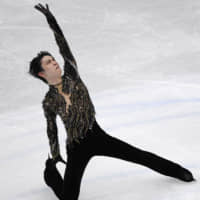 Two-time Olympic champion Yuzuru Hanyu claimed the silver medal at the world championships on Saturday night in Saitama after returning from a four-month layoff due to a right ankle injury. | KYODO