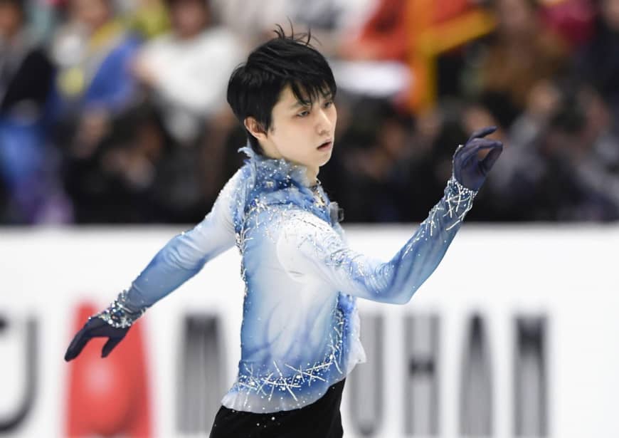 Two-time Olympic champion Yuzuru Hanyu performs his short program at the world championships on Thursday. Hanyu is in third place with 94.87 points.