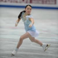 Rika Kihira performs her short program at the world championships on Wednesday. Kihira is in seventh place with 70.90 points. | DAN ORLOWITZ