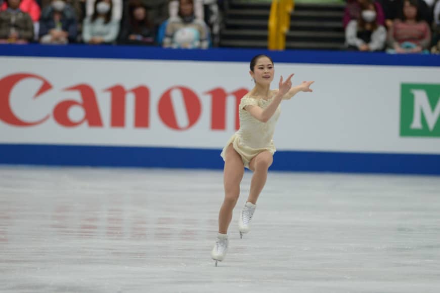 Satoko Miyahara skates in the women