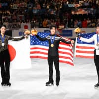 Men\'s singles winner Nathan Chen (center), runner-up Yuzuru Hanyu (left) and third-place finisher Vincent Zhou pose after the medal ceremony on Saturday at Saitama Super Arena. | DAN ORLOWITZ
