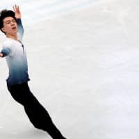 Vincent Zhou performs his short program at the world championships on Thursday. The American is in fourth place with 93.37 points. | REUTERS