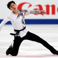 Vincent Zhou competes to \"Crouching Tiger, Hidden Dragon\" in the men\'s free skate. The American claimed the bronze with 281.16 points. | REUTERS