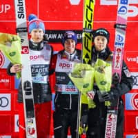 Third-place finisher Ryoyu Kobayashi (right) poses with second-place Robert Johansson (left) and winner Stefan Kraft after the FIS Men\'s Ski Jumping World Cup event in Lillehammer, Norway, on Tuesday. | AFP-JIJI