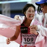 Mizuki Tanimoto smiles after finishing 11th at the Nagoya Women\'s Marathon on Sunday at Nagoya Dome. Tanimoto was one of five Japanese runners to qualify for the Marathon Grand Championship, which will serve as a qualifier for Tokyo 2020. | KYODO