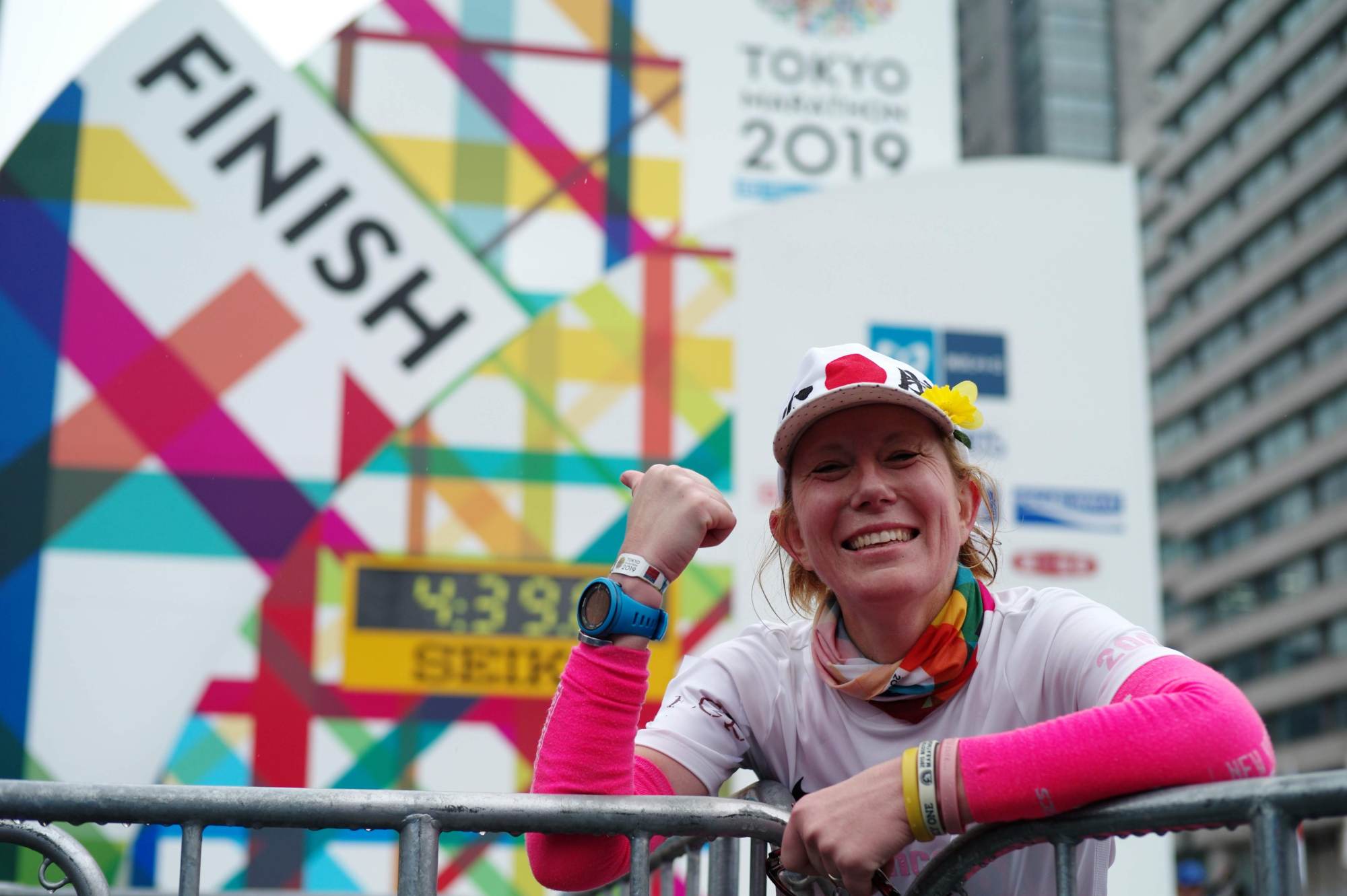 Vanessa Oshima, a cancer survivor from New Zealand who lives in Japan, catches her breath at the finish line of the Tokyo Marathon on Sunday. | RYUSEI TAKAHASHI