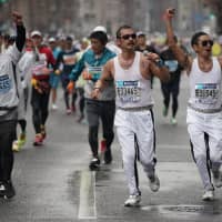 Runners dressed as Freddie Mercury, the main character in the popular Oscar-winning film \"Bohemian Rhapsody,\" participate in Sunday\'s Tokyo Marathon along with other entrants wearing a variety of costumes. | RYUSEI TAKAHASHI