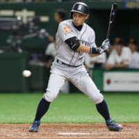 Mariners right fielder Ichiro Suzuki is called out on strikes against the Giants in the fourth inning of their preseason exhibition game at Tokyo Dome on Monday. | AP