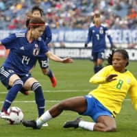 Nadeshiko Japan\'s Yui Hasegawa controls the ball as Brazil\'s Miraildes defends during their match at the SheBelieves Cup on Saturday in Nashville, Tennessee. Japan won 3-1. | KYODO