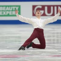 Italy\'s Matteo Rizzo celebrates after his successful short program. He scored 93.37, leaving him in fifth place. | DAN ORLOWITZ