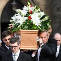 Pallbearers carry the coffin of former England goalkeeper Gordon Banks after a funeral service in Stoke-on-Trent, England, on Monday. | AFP-JIJI