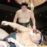 Then-ozeki Wakanohana beat then-yokozuna Takanohana, his younger brother, in a playoff to capture the Emperor\'s Cup at the Kyushu Basho in November 1995 in the only match between them. | KYODO