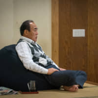 The former Tamanoi stablemaster watches training at Tamanoi Beya in May 2017. | JOHN GUNNING