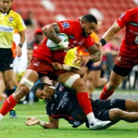 Rahboni Warren Vosayaco of the Sunwolves carries the ball against the Lions in Singapore on Saturday. | REUTERS