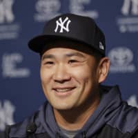 Yankees hurler Masahiro Tanaka speaks during a news conference on Wednesday in New York. | AP