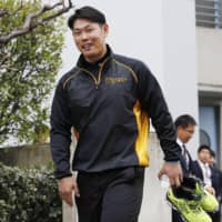 Tigers backup catcher Fumihito Haraguchi returns to practice on Thursday in Nishinomiya, Hyogo Prefecture. | KYODO