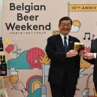 Belgian Ambassador Gunther Sleeuwagen (right), honorary chairman of the Belgian Beer Weekend Committee, poses for a photo with Shintaro Konishi, president of Konishi Brewing Co. and chairman of the Belgian Beer Weekend Committee, during a news conference at the Belgian Embassy on March 13. This is the Belgian Beer Weekend\'s 10th anniversary and the event, which begins in Nagoya on April 24, will then travel to Yokohama, Hibiya, Osaka and Roppongi, ending on Sept. 16. | YOSHIAKI MIURA