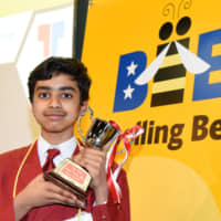 Ariya Narayanasamy,12, from the India International School in Japan, poses with his trophy after winning the 10th Japan Times Bee on Sunday at Tokyo Global Gateway in Koto Ward. Full coverage to appear in Tuesday\'s issue. | SATOKO KAWASAKI