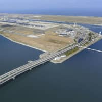 The bridge connecting Kansai International Airport and the mainland, which had been damaged by a typhoon, is completely reopened Monday. | KYODO