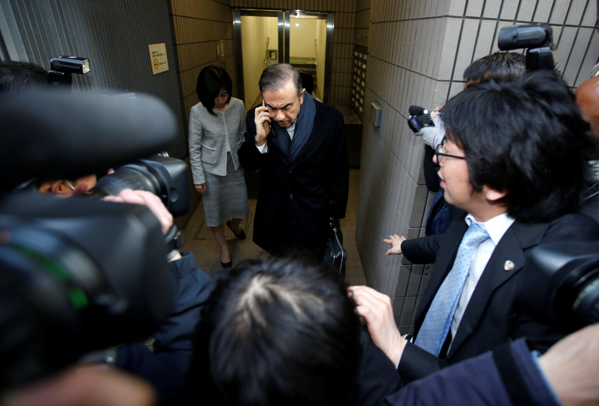 Former Nissan Chairman Carlos Ghosn leaves his lawyer's office in Tokyo on March 12. | REUTERS