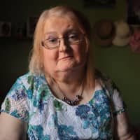 Aimee Stephens posing at her home in Michigan in this photo obtained Monday. The U.S. Supreme Court said Monday it will take up the question of whether gay and transgender workers are protected by federal law that bars discrimination in the workplace. | CHARLES WILLIAM KELLY / ACLU / VIA AFP-JIJI