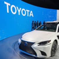 A prototype of Toyota Motor Corp.\'s self-driving vehicle is displayed at a media preview of the Consumer Electronics Show in Las Vegas in January. | KYODO