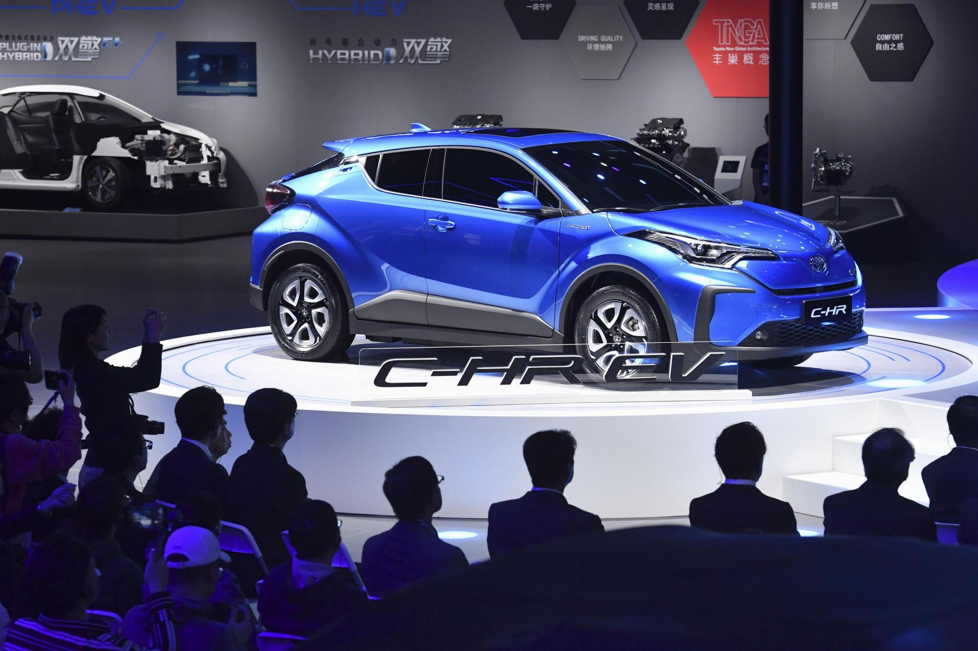 Toyota Motor Corp. unveils the C-HR electric SUV model at the International Automobile and Manufacturing Technology Exhibition in Shanghai on Tuesday. | KYODO