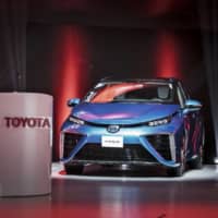 The Toyota Mirai fuel cell vehicle is displayed at the Shanghai auto show in April 2017. | BLOOMBERG