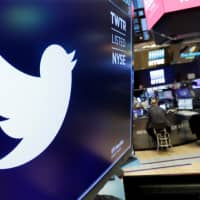 The logo for Twitter is displayed above a trading post on the floor of the New York Stock Exchange in 2018. Twitter reported financial results Tuesday. | AP