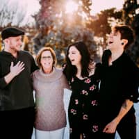 Matthew Eledge; Elliott Dougherty; Matthew\'s mother, Cecile Eledge; and Elliot\'s sister and egg donor Lea Yribe pose in Omaha, Nebraska, on March 10, when Cecile was pregnant with her son\'s child. | REUTERS