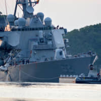 The USS Fitzgerald guided-missile destroyer returns to the U.S. Navy base in Yokosuka, Kanagawa Prefecture, on June 17, 2017, following a collision with a merchant vessel while operating southwest of Tokyo Bay. | NAVY MEDIA CONTENT SERVICES