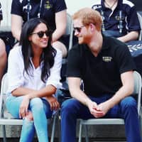 Britain\'s Prince Harry and his then-girlfriend, actress Meghan Markle, watch wheelchair tennis during the Invictus Games in Toronto in September 2017. | REUTERS