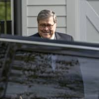 Attorney General William Barr leaves his home in McLean, Virginia, on Wednesday morning. Special counsel Robert Mueller\'s redacted report on Russian interference in the 2016 election is expected to be released publicly on Thursday and has said he is redacting four types of information from the report. | AP