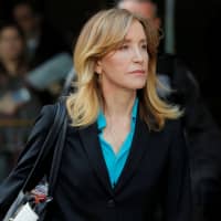Actor Felicity Huffman, facing charges in a nationwide college admissions cheating scheme, leaves federal court in Boston April 3. She and 13 others pleaded guilty Monday. | REUTERS