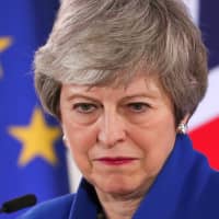 British Prime Minister Theresa May holds a news conference in Brussels on April 11 following an extraordinary European Union summit to discuss Brexit. | REUTERS
