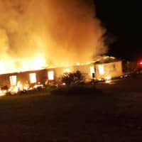 Smoke and fire billows from the Highlander Education and Research Center in New Market, Tennessee, March 29 in this still image taken from social media on Wednesday. | FACEBOOK / NEW MARKET VFD / VIA REUTERS