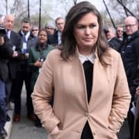 White House Press Secretary Sarah Huckabee Sanders departs after speaking to reporters at the White House in Washington April 2. | REUTERS