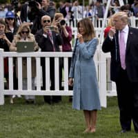U.S. President Donald Trump and first lady Melania Trump participate in the Easter Egg Roll on the South Lawn of the White House in Washington on Monday. | BLOOMBERG