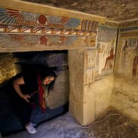 A tourist enters the newly discovered tomb of Tutu near Sohag, Egypt, on Friday. | REUTERS