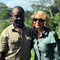 American tourist Kim Endicott and field guide Jean-Paul Mirenge pose Monday a day after they were rescued following their kidnapping by unknown gunmen in Uganda\'s Queen Elizabeth National Park. | WILD FRONTIERS / VIA AP